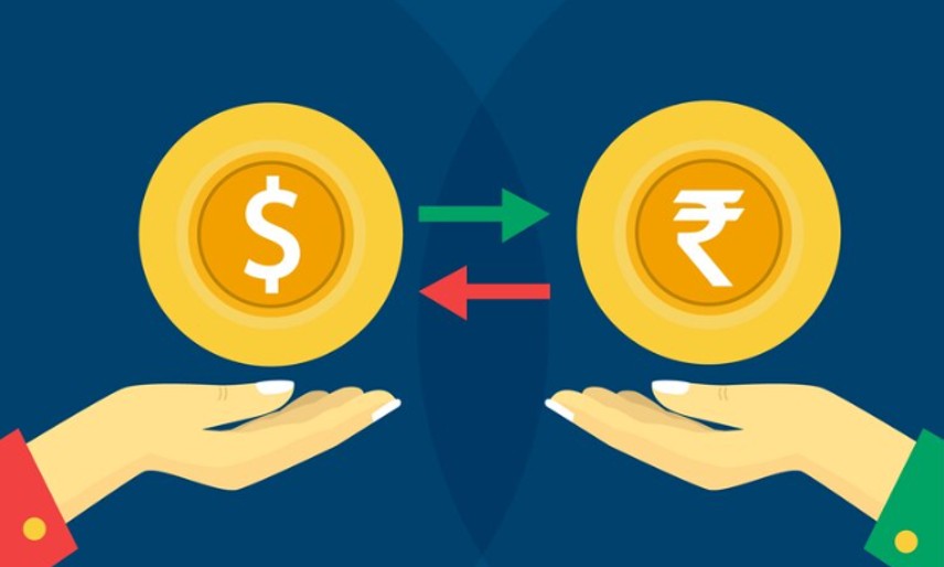 Indian Rupees and US Dollars currency notes with travel essentials - CrossworldForex